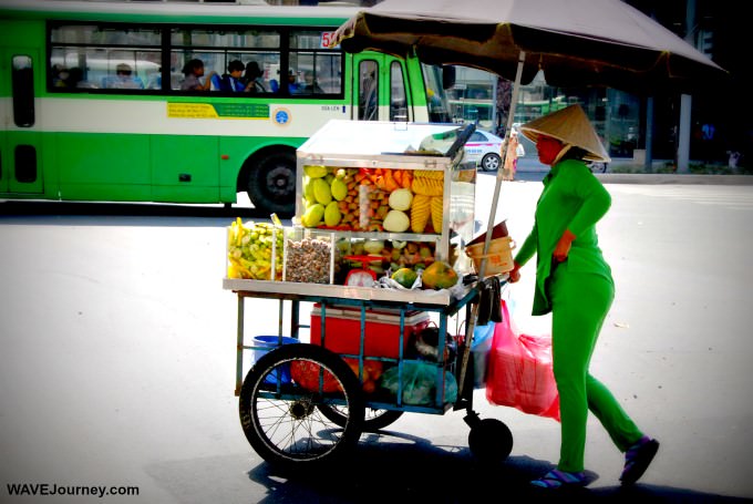 Woman with Fruit For Sale in Saigon