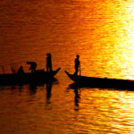 Fishermen on the Mekong River at Sunset
