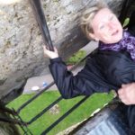 Barb Dodge kissing the Blarney Stone. Photo by George Dodge.