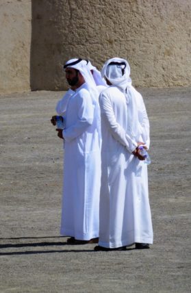 Men in Abu Dhabi wearing dish-dasha robes